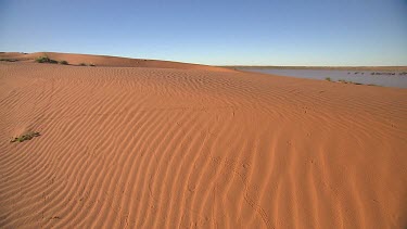 Simpson Desert in flood. Big Red sand dune. WS. Ripples of sand on sand dune from wind.