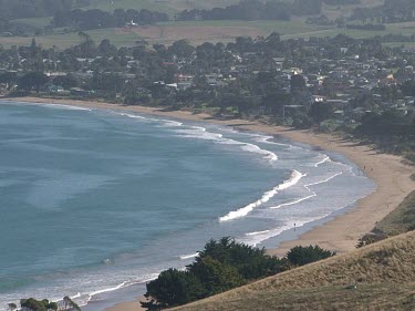 Apollo Bay. Suburb, beach coast houses waves. Two shots