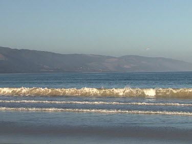 Bay, with gentle waves - no people in shot