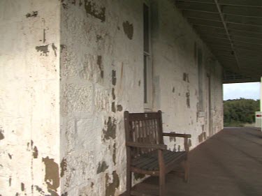 Cape Otway lighthouse building. Old building with paint peeling, white-washed.