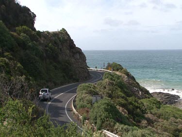 Driving on Great Ocean Road. Road signs, windy road.