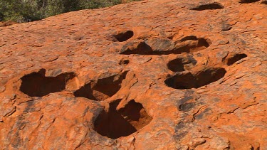 Eroded potholes in rocks of Uluru