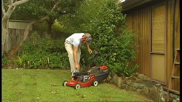 Man Mowing Lawn