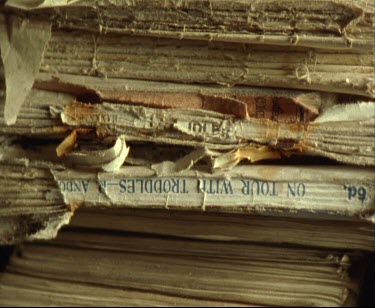 Stacks of paper, old novels and books stacked in a pile. Close Up.