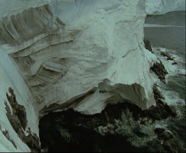 Thick ice of ice sheet or ice shelf at the coast. Polar landscape.