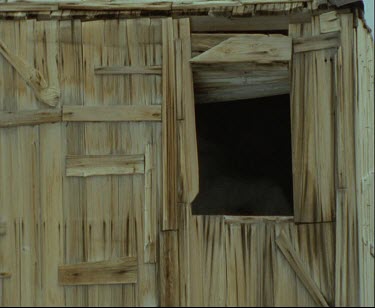 Dramatic recreation Frank Hurley photography Mawson's Huts. Commonwealth Bay. Australian Antarctic. It is snowing.