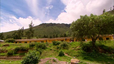 Looking up at the surounding mountain side with terracota tiled vilas in the foreground