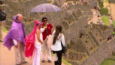 Panning in on the misty mountains surrounding Machu Picchu