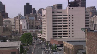 Light trafic in Boston filmed from above at an angle from a distance.