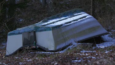 An upside-down turned leisure boat in Sweden, zoomed in after a while