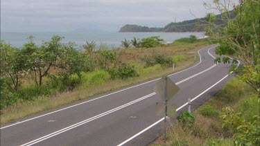 Car driving on rural road.