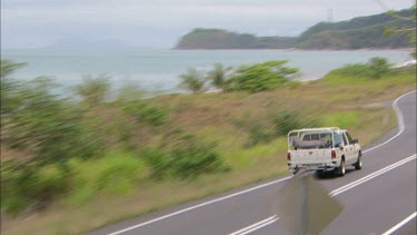 Car driving on rural road.