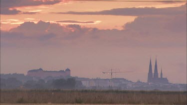 Uppsala and the Uppsala Cathedral at sundown from a distance.