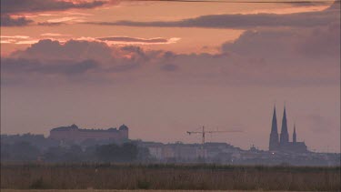 Uppsala and the Uppsala Cathedral at sundown from a distance.