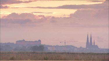 Uppsala and the Uppsala Cathedral at sundown from a distance.