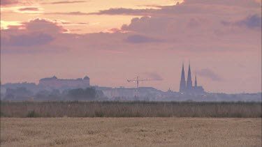 Uppsala and the Uppsala Cathedral at sundown from a distance.