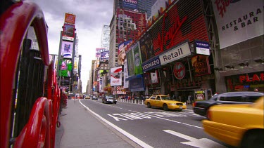 Times Square. Advertising LCD billboards. Broadway. Yellow New York cabs and traffic.