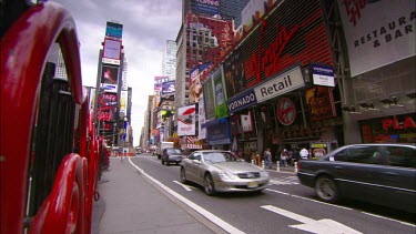 Times Square. Advertising LCD billboards. Broadway. Yellow New York cabs and traffic.