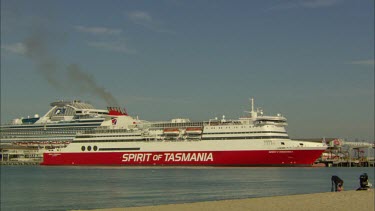 Spirit of Tasmania ferry pulling away from pier dock.