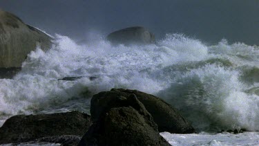 stormy sea, waves crashing over rocks