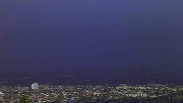 Fog blowing over Cape Town, early morning. Table Mountain in BG.