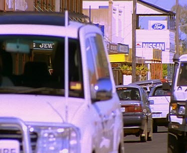 Small outback town. Hotel Verandah. Street shops main street.