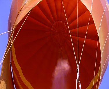 Hot-air balloons flying over desert. Aerial shots from balloon of desert.