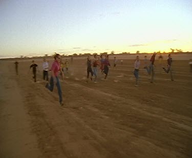 Outback running races. People drinking family fun