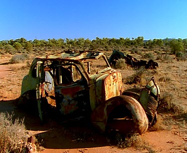 Ghost mine and ghost town. Ruin. Dust devil. Railway track line. Ruins of buildings. dust storm whirlwind tornado.