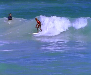 Surfer surfing wave