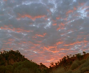 Sunset mountain ridge pink and blue clouds