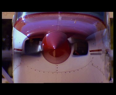 Propeller of light plane. Plane takes off. AERIALS of Nullarbor. Very flat expanse of desert plain.