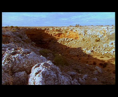 Walking into cave. Nullarbor caves.