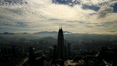 A timelapse of Sunrays beaming onto the city of Kuala Lumpur, Malaysia with the world renown Petrona Twin Towers in view.