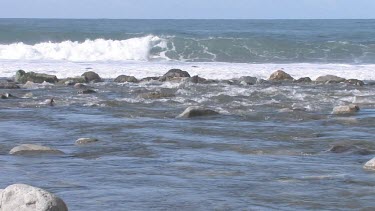 Gentle waves on pristine cove and shoreline