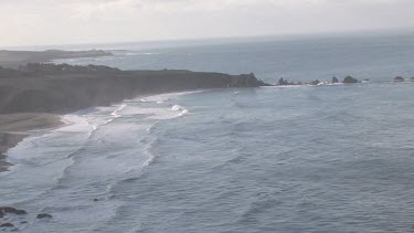 Gentle waves on pristine cove and shoreline