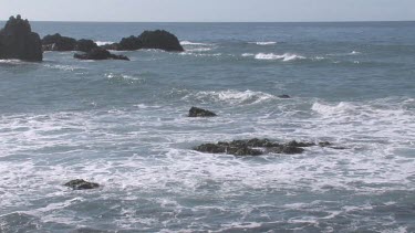 Gentle waves on pristine cove and shoreline