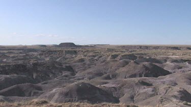 Desert valley with mounds and hills; moonscape