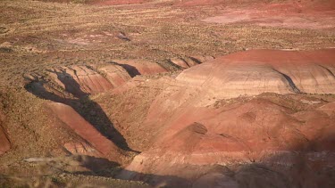 Desert valley overlooking mounds and hills; moonscape