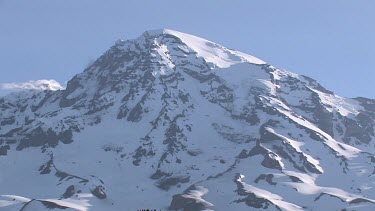 Mountain with snowy peak and blue sky