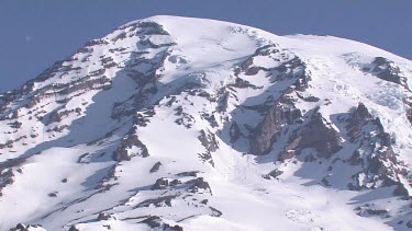 Mountain with snowy peak and blue sky