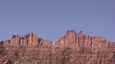 Rocky Canyon wall; sheer and deep; monumental buttes, mesas, and boulders