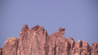 Rocky Canyon wall; sheer and deep; monumental buttes, mesas, and boulders