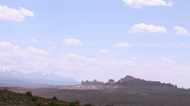 Rocky Canyon; sheer and deep; monumental buttes, mountains, boulders, mesas, and sky