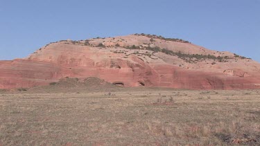 Rocky Canyon; sheer and deep; monumental buttes, boulders, Indian caves, and mesas