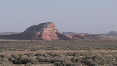 Rocky Canyon; sheer and deep; monumental buttes, boulders, Indian caves, and mesas