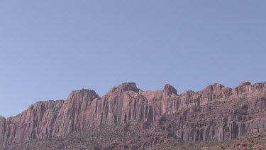 Rocky Canyon Wall; sheer and deep; monumental buttes, boulders, and mesas