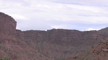 Rocky Canyon Walls; a trail and ridge; looking out toward the mountains