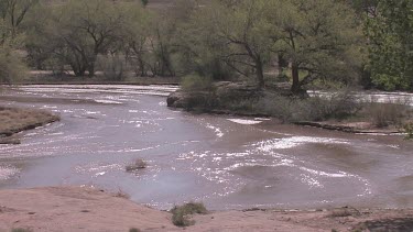 A rushing desert moumtain river; near Canyon de Chilly