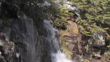 Cascading, mountainside waterfall in spring